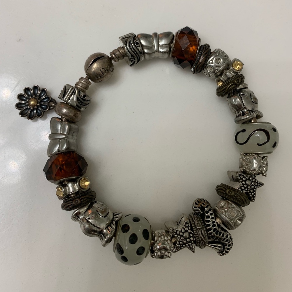 Beautiful charm bracelet with one Pandora …